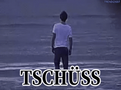 A Man Standing On A Beach With The Word Tschuss Written Above Him GIF