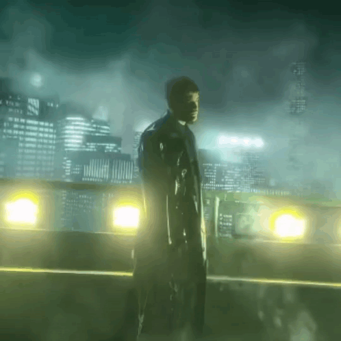 A Man Standing On A Bridge Holding A Gun In Front Of A City Skyline GIF