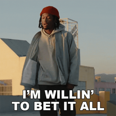 A Man Standing On A Rooftop With The Words " I 'M Willin ' To Bet It All " GIF