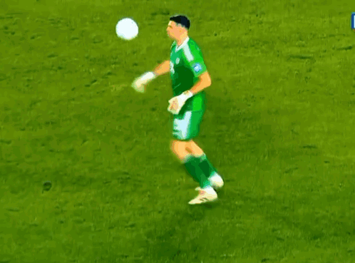 A Man Standing On A Soccer Field Wearing Adidas Shoes GIF