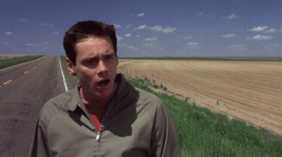 A Man Standing On The Side Of A Road With The Words " Oh Well " Above Him GIF
