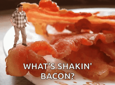 A Man Standing On Top Of A Plate Of Bacon With The Words " What 'S Shakin ' Bacon " GIF