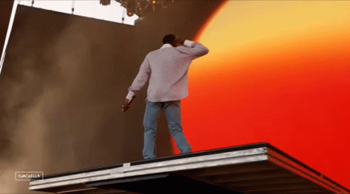 A Man Standing On Top Of A Roof With The Word Cancel On The Bottom Right GIF