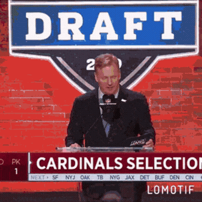A Man Stands At A Podium With A Sign That Says Draft GIF