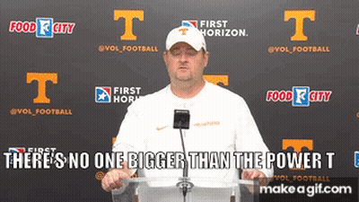 A Man Stands At A Podium With The Words " There 'S No One Bigger Than The Power T " In Front Of Him GIF