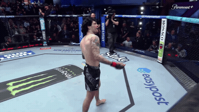 A Man Stands In A Boxing Ring With A Paramount Logo On The Corner GIF