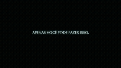 A Man Stands In A Dark Room Surrounded By Boxes And A Wall That Says " Destino " GIF