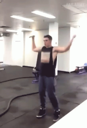 A Man Stands In A Gym With His Arms Outstretched And Failarmy Written On The Bottom GIF