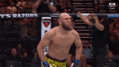 A Man Stands In Front Of A Banner That Says Razors GIF