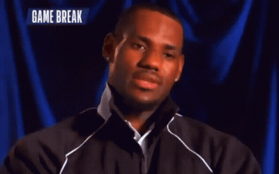 A Man Stands In Front Of A Blue Curtain With The Words Game Break On The Bottom GIF
