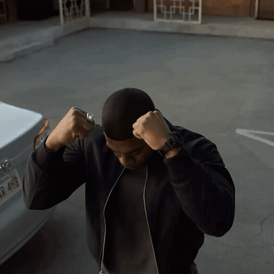 A Man Stands In Front Of A Car With A License Plate That Says R 4H9 GIF