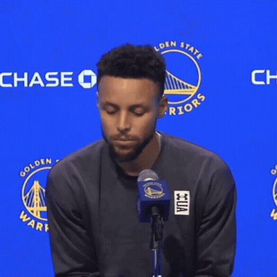 A Man Stands In Front Of A Chase Sign GIF