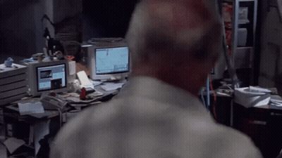 A Man Stands In Front Of A Computer Monitor That Says ' I 'M Sorry ' On It GIF
