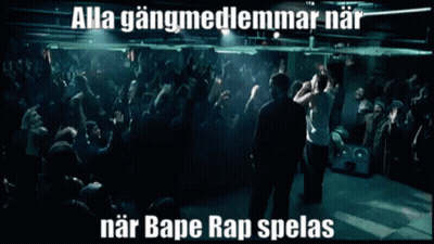 A Man Stands In Front Of A Crowd With The Words Alla Gangmedlemmarnar Near Bape Rap Spelas Below Him GIF