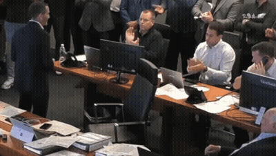 A Man Stands In Front Of A Desk With A Viewsonic Computer GIF