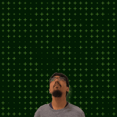 A Man Stands In Front Of A Green Background With Stars And The Number 26 GIF