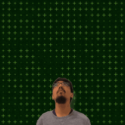 A Man Stands In Front Of A Green Background With The Number 15 + 1 Written On It GIF