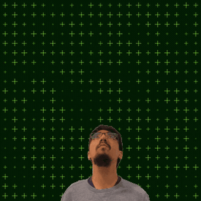 A Man Stands In Front Of A Green Background With The Number 19 + 15 On It GIF