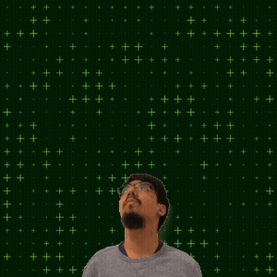 A Man Stands In Front Of A Green Background With The Number 9 + 14 GIF
