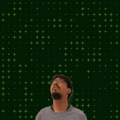 A Man Stands In Front Of A Green Background With The Numbers 1 And 2 GIF