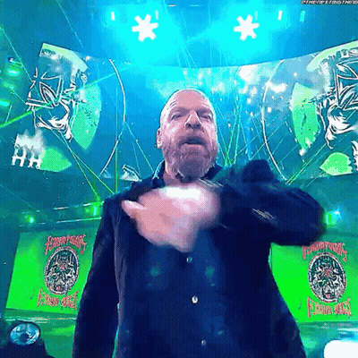 A Man Stands In Front Of A Green Sign That Says ' Champions ' On It GIF