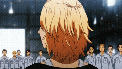 A Man Stands In Front Of A Group Of Men Wearing Uniforms With The Letter T On The Front GIF