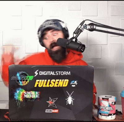 A Man Stands In Front Of A Laptop That Says Digitalstorm Fullsend GIF