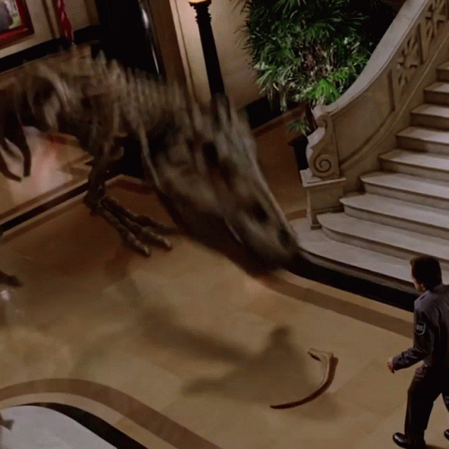 Man Standing In Front Of Dinosaur GIF