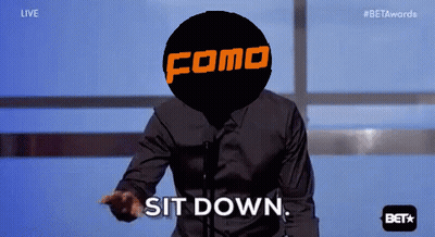 A Man Stands In Front Of A Microphone With A Como Logo On His Head GIF