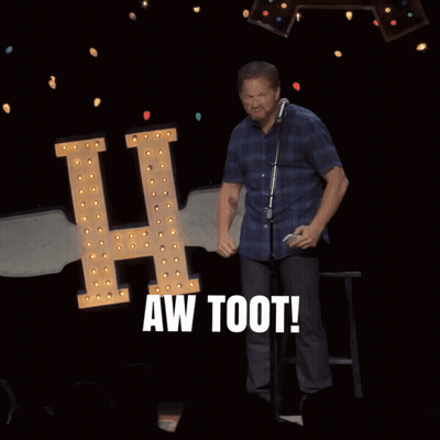 A Man Stands In Front Of A Microphone With The Words Aw Toot Behind Him GIF