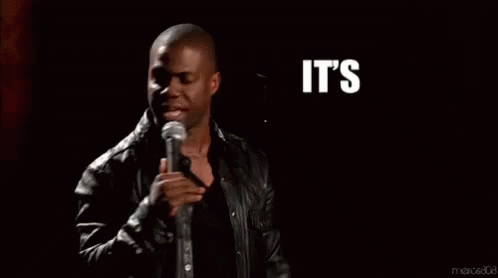 A Man Stands In Front Of A Microphone With The Words It 'S About To Go Down GIF