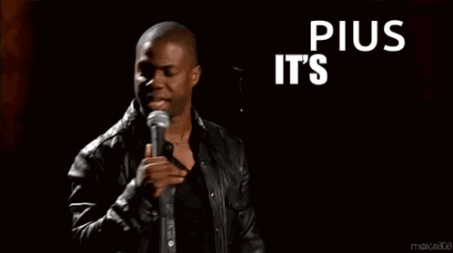 A Man Stands In Front Of A Microphone With The Words " Plus It 'S About To Go Down " GIF