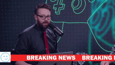A Man Stands In Front Of A Microphone With The Words We Have Breaking Above Him GIF