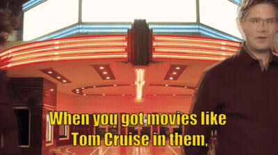 A Man Stands In Front Of A Movie Theater With The Words " When You Got Movies Like Tom Cruise In Them " GIF