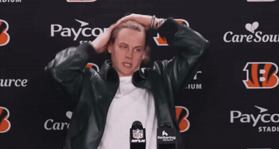A Man Stands In Front Of A Paycor Stadium Sign GIF