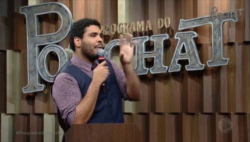 A Man Stands In Front Of A Programa Do Chat Sign GIF