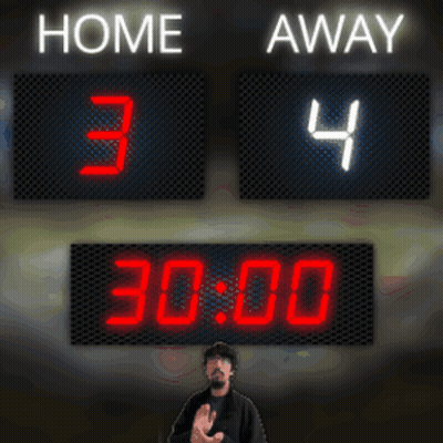A Man Stands In Front Of A Scoreboard That Says Home 34 Away 22 30 GIF