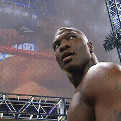 A Man Stands In Front Of A Screen That Says ' Ania ' On It GIF