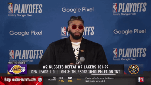 A Man Stands In Front Of A Screen That Says ' Playoffs ' On It GIF