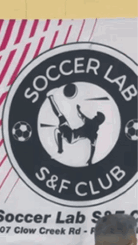 A Man Stands In Front Of A Sign For Soccer Lab GIF