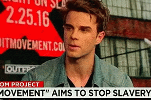 A Man Stands In Front Of A Sign That Says 2.25.16 GIF