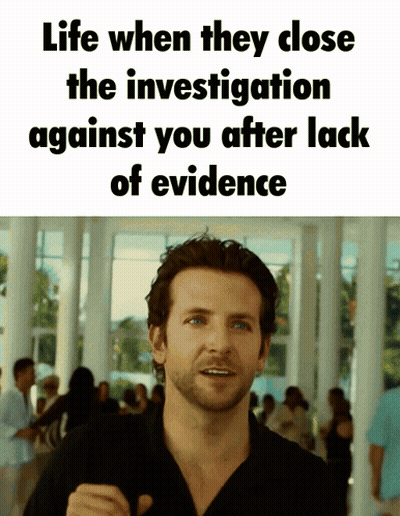 A Man Stands In Front Of A Sign That Says Life When They Close The Investigation Against You After Lack Of Evidence GIF