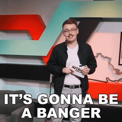 A Man Stands In Front Of A Sign That Says Nitro GIF