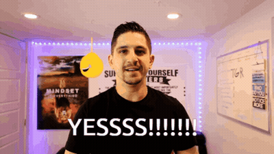 A Man Stands In Front Of A Sign That Says Yesss !!! GIF