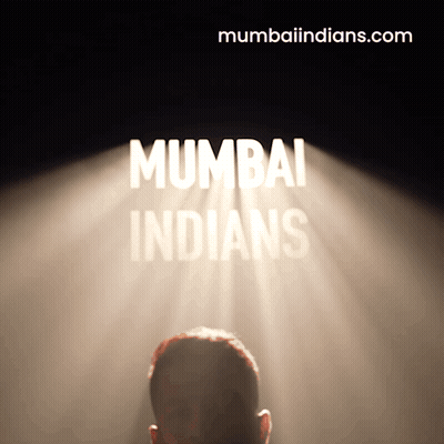 A Man Stands In Front Of A Spotlight That Says Mumbai Indians On It GIF