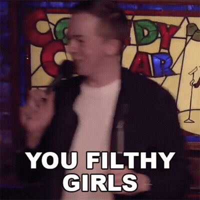 A Man Stands In Front Of A Stained Glass Window And Says " You Filthy Girls " GIF