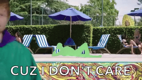 A Man Stands In Front Of A Swimming Pool With The Words " Cuz I Don 'T Care " On The Bottom GIF