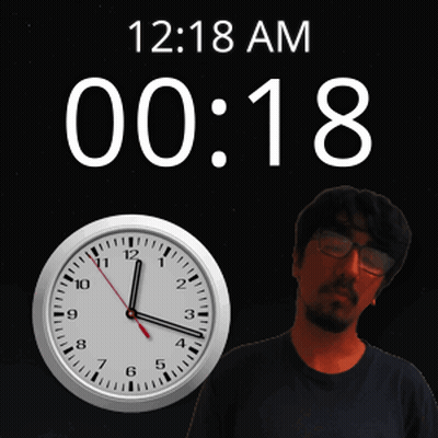 A Man Stands In Front Of A Wall Clock That Says 12:18 Am GIF