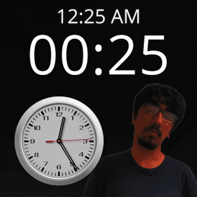 A Man Stands In Front Of A Wall Clock That Says 12:25 Am GIF