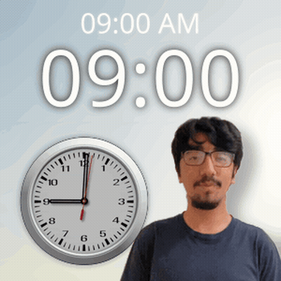 A Man Stands In Front Of A Wall Clock That Says 9:00 Am GIF